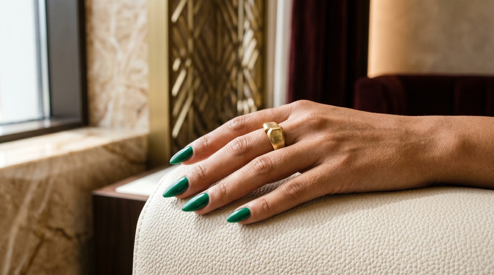 Glossy emerald-green almond nails