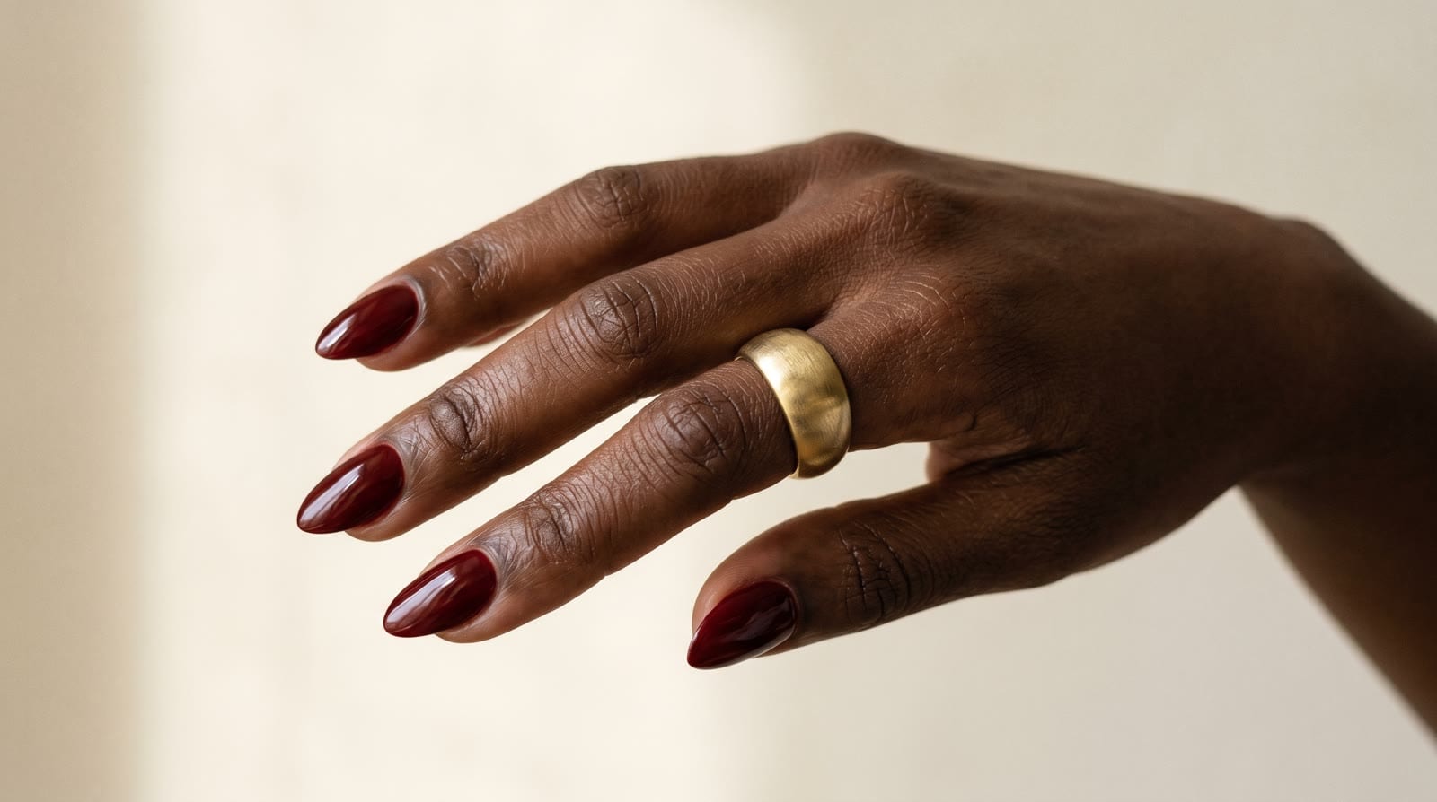 A close shot of a finished glossy manicure